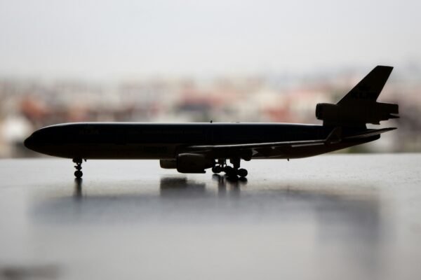 white and gray airplane scale model close-up photography