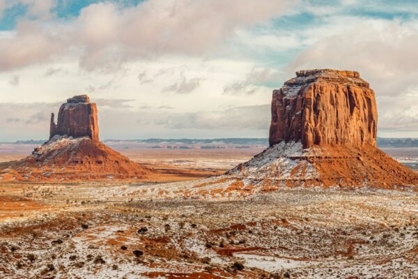 a large rock formation in the middle of a desert