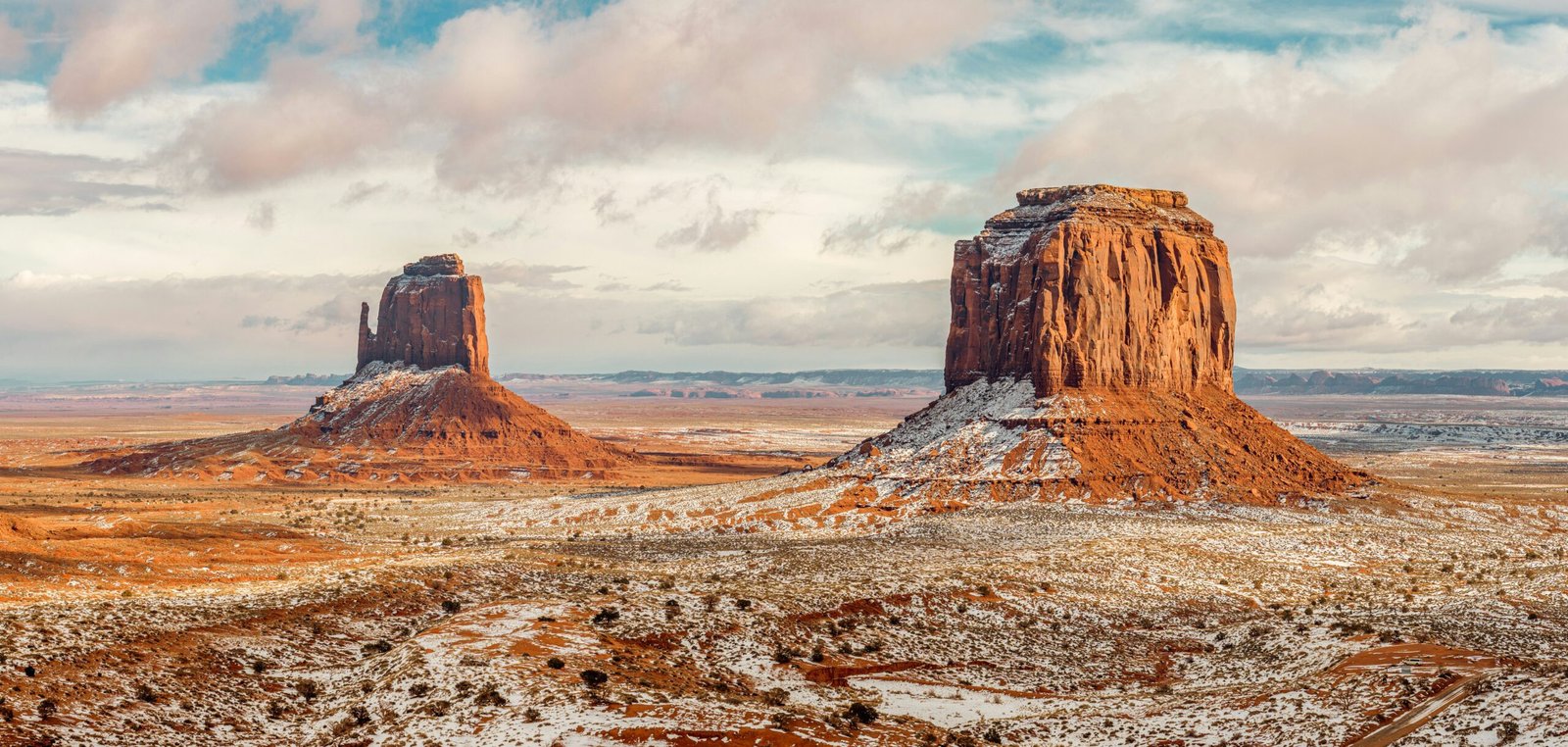 a large rock formation in the middle of a desert