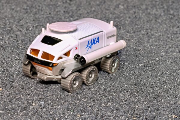 A toy truck with a tank on the back of it