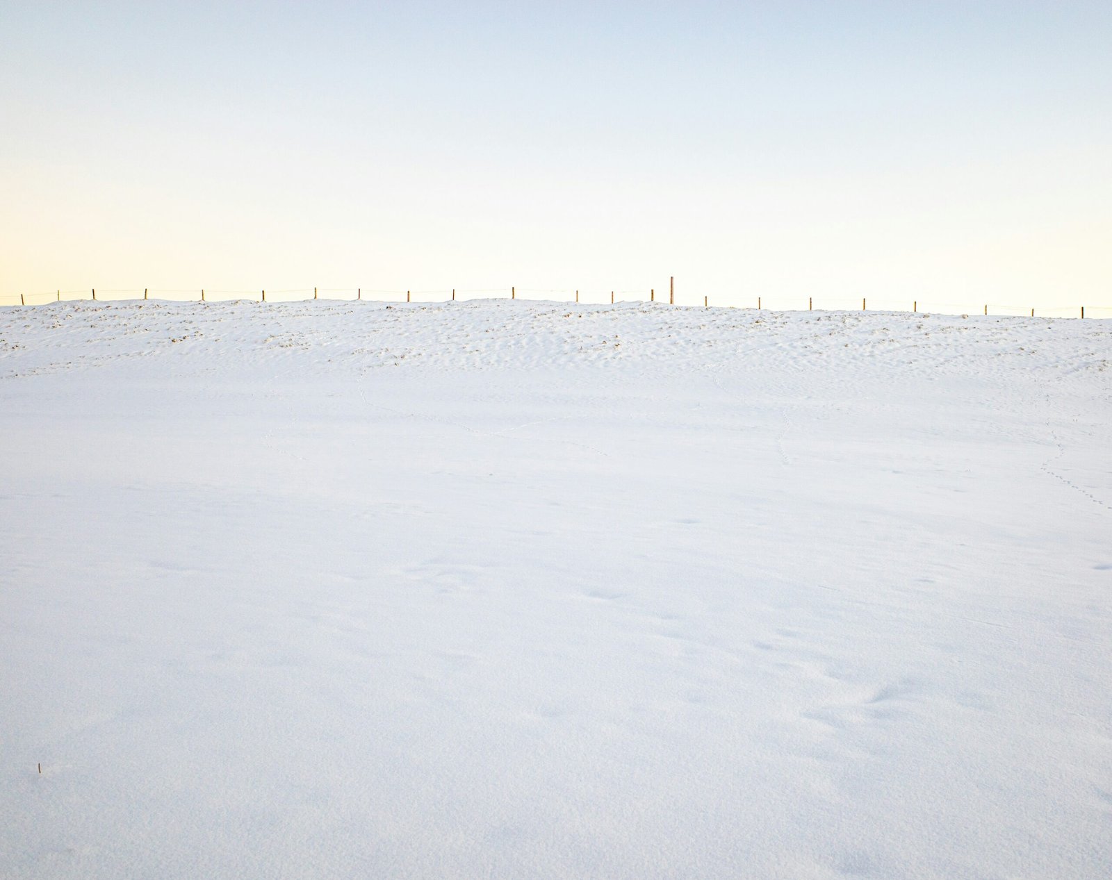 A man riding skis down a snow covered slope