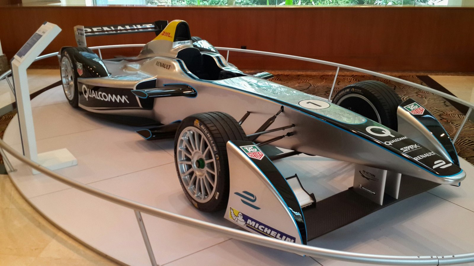 Silver formula e race car on display
