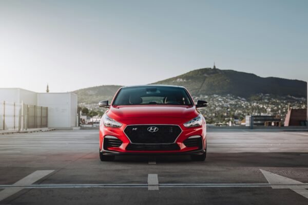 red bmw m 3 on road during daytime