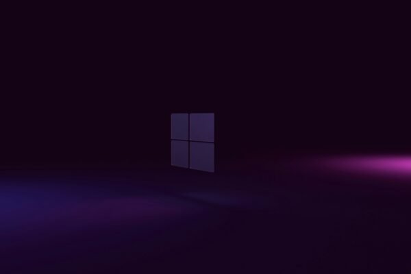 a dark room with a purple light coming out of the window