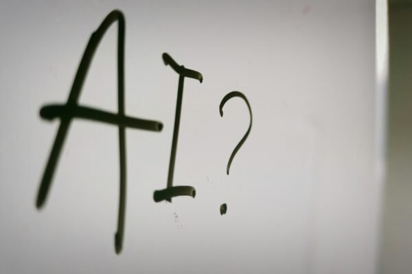 a sign with a question mark and a question mark drawn on it