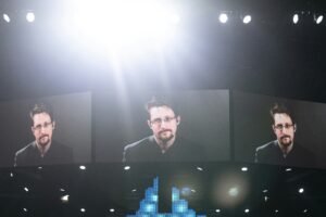 men's black suit on screen