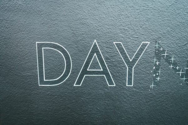 black leather textile with gold m