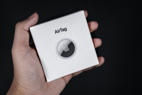 white and black box on persons hand