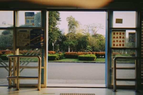 a view of a street through a glass door
