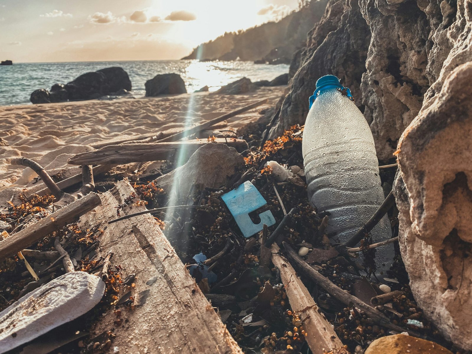 a bottle of water on a beach